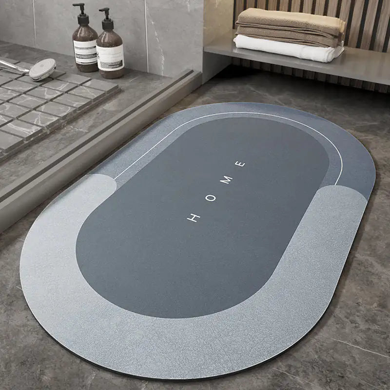 oval blue Napa Skin Super Absorbent Bath Mat on the floor near a shower