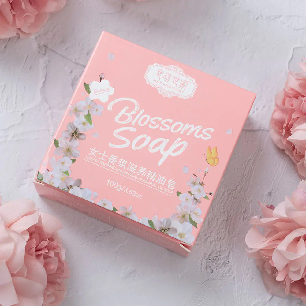 Cherry Blossom Petals Soap box beside fresh pink flowers