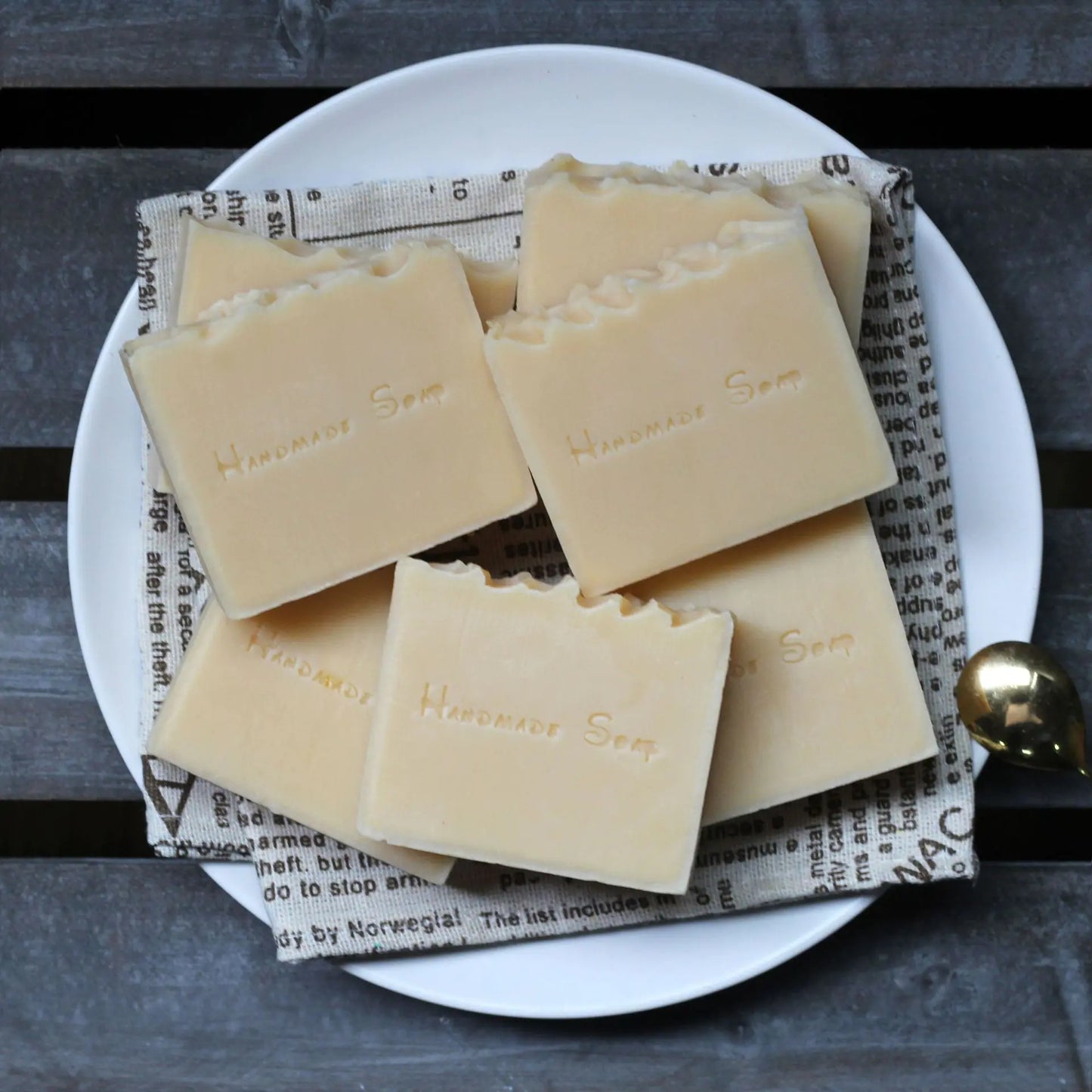 multiple bars of handmade soap on a lined plate